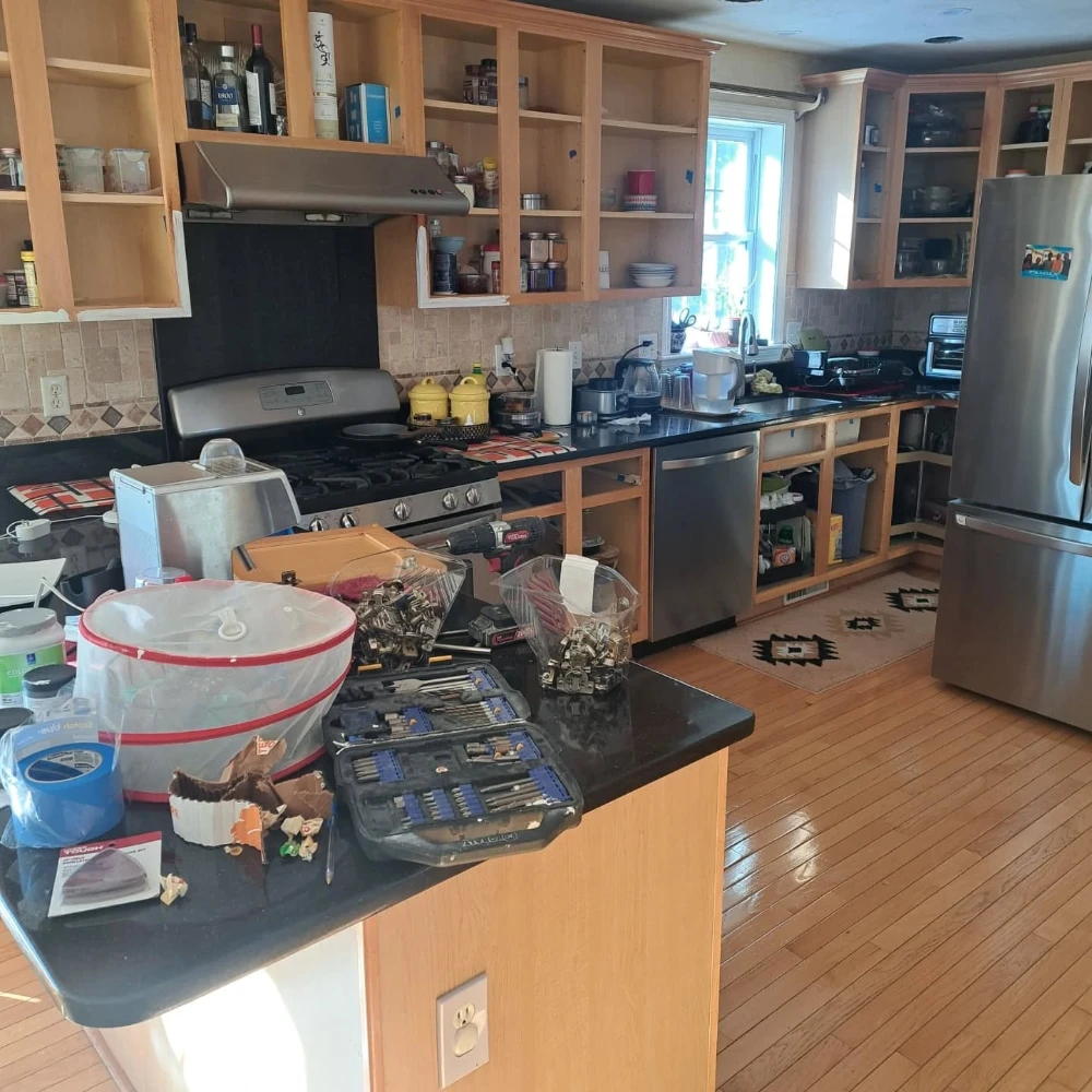 Kitchen interior before a full repaint and cabinet refinishing