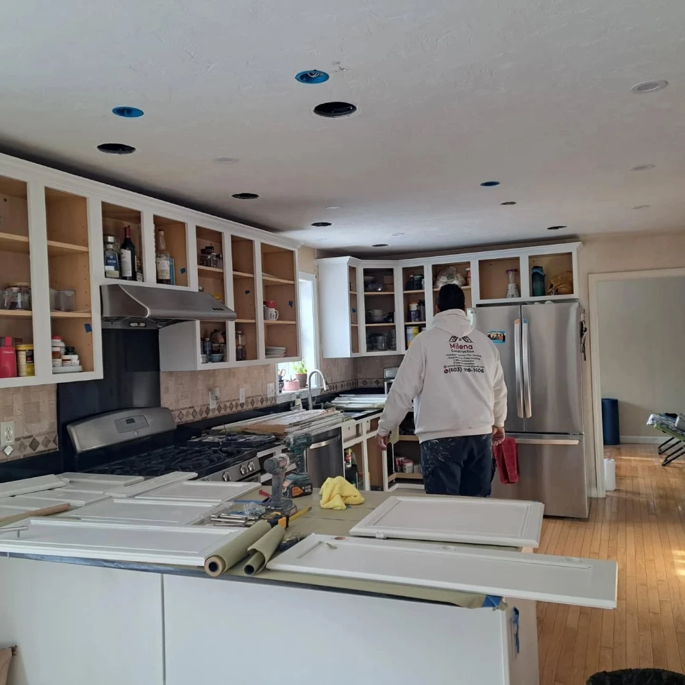 The Milena Construction crew refinishing a kitchen during a remodel