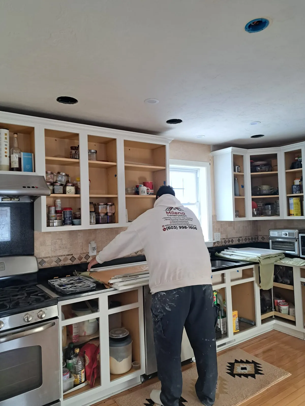 Kitchen cabinets being painted during an interior remodel