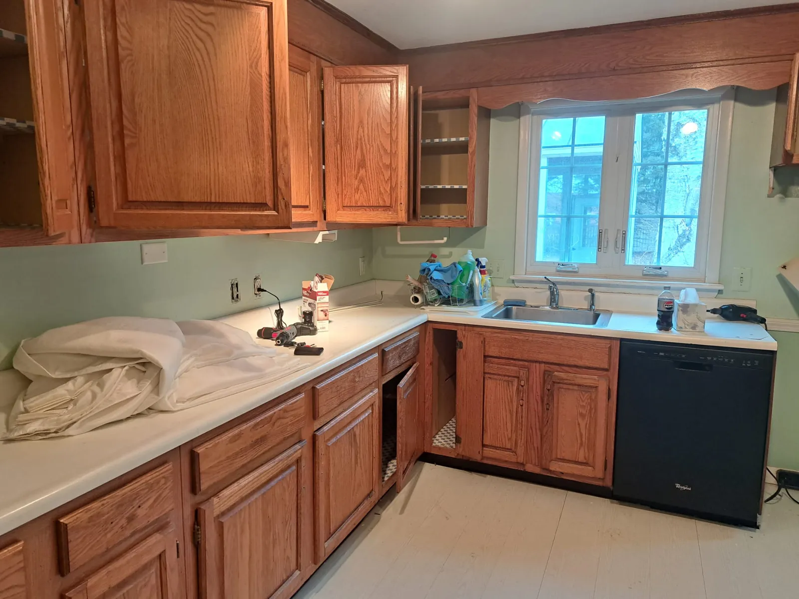 Kitchen with wood cabinets before an interior repaint