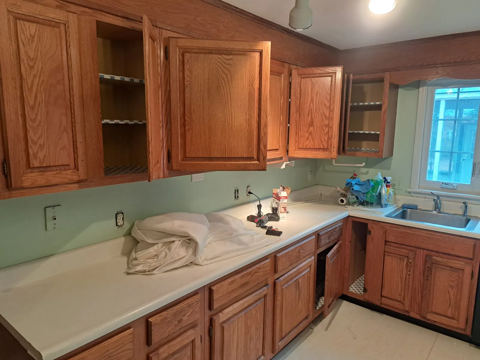 Wood kitchen cabinets prior to refinishing