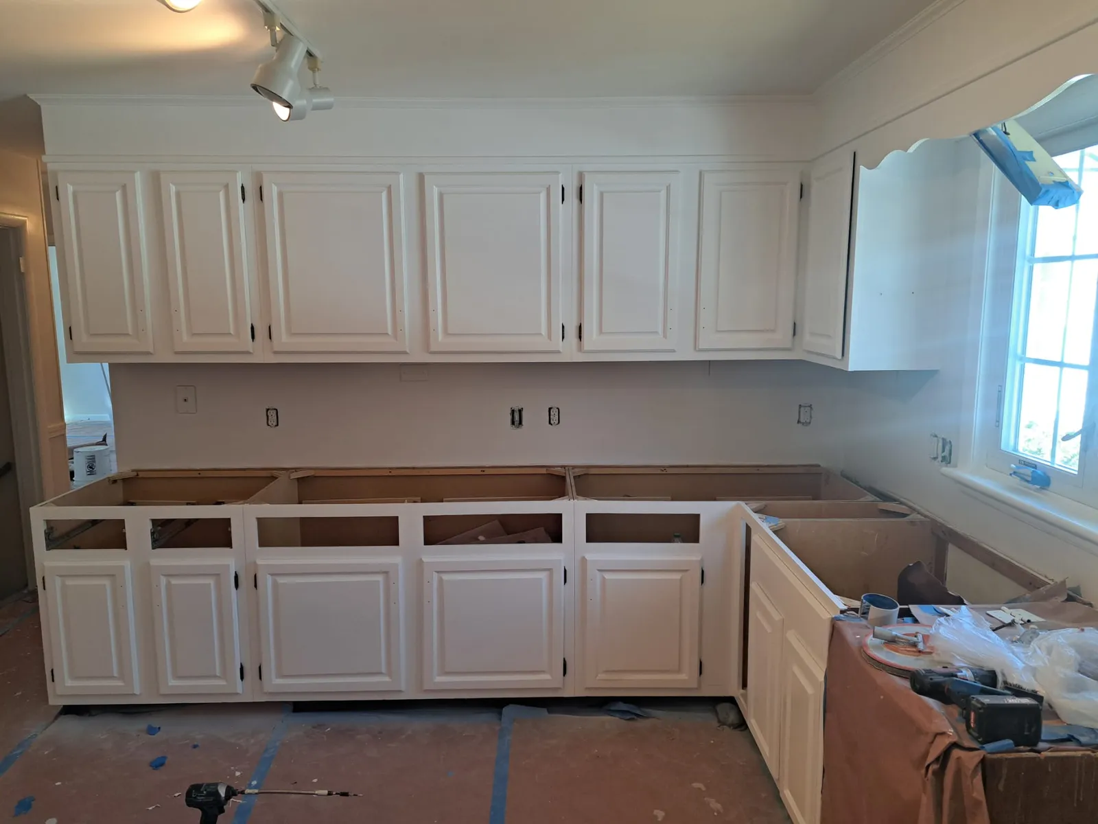 White kitchen cabinets during a repaint and remodel