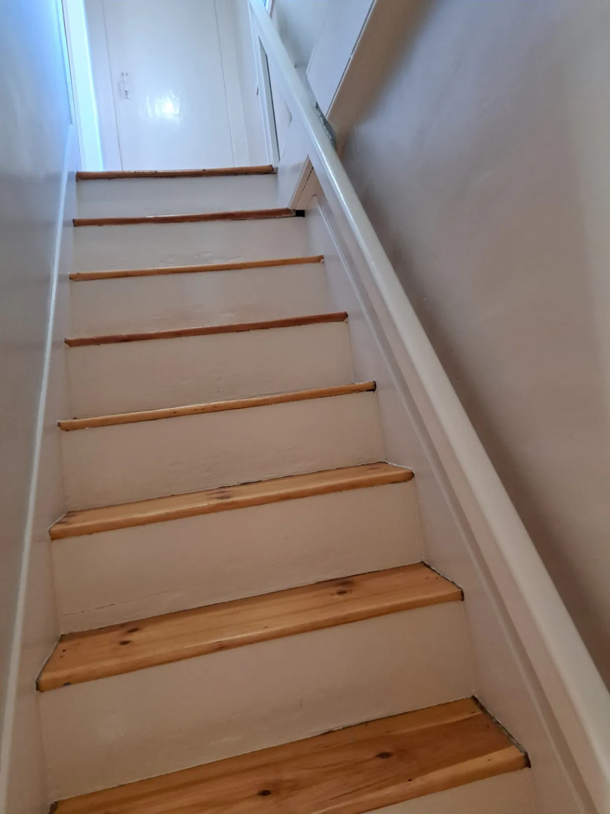 Wood staircase with newly finished treads