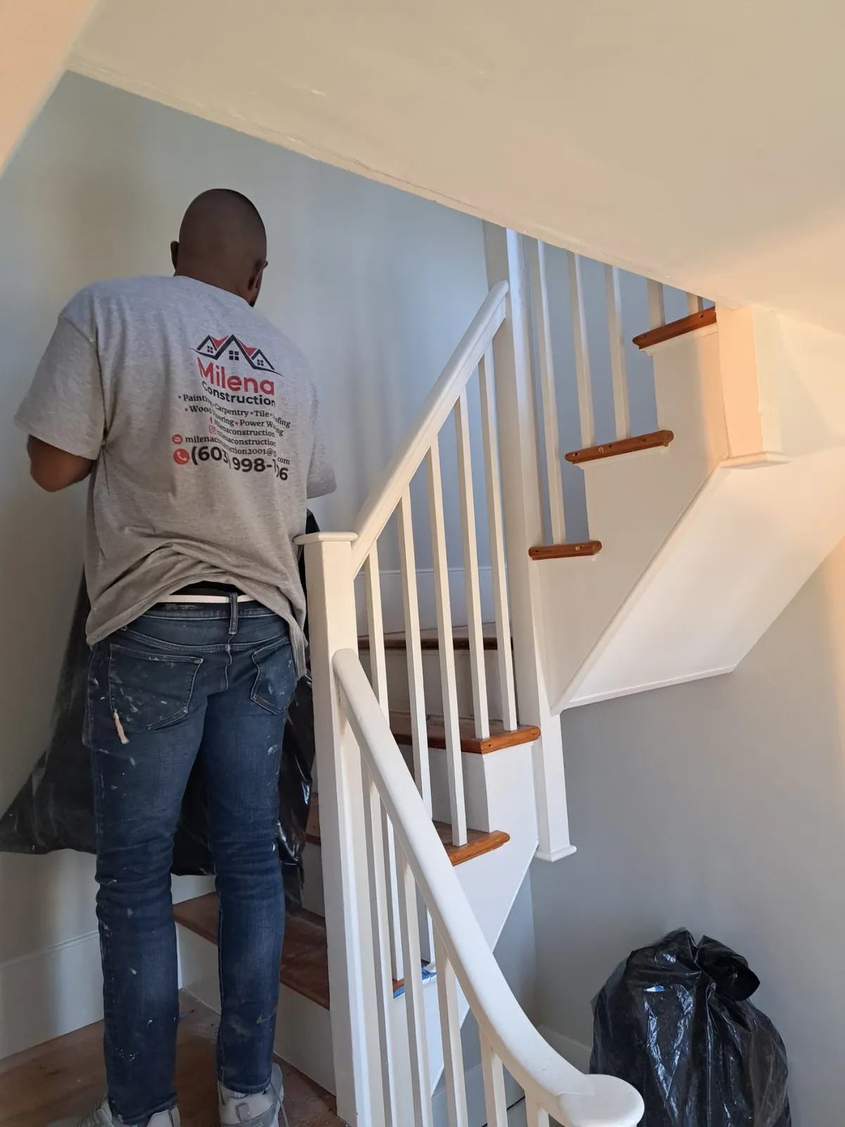 A Milena Construction team member at work on a staircase