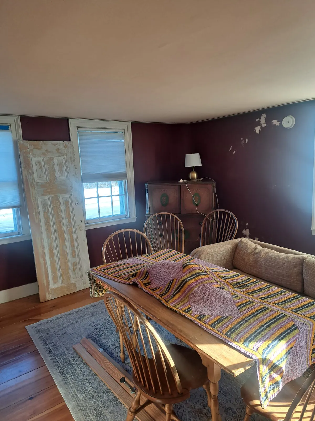 Dining room with a deep plum accent wall