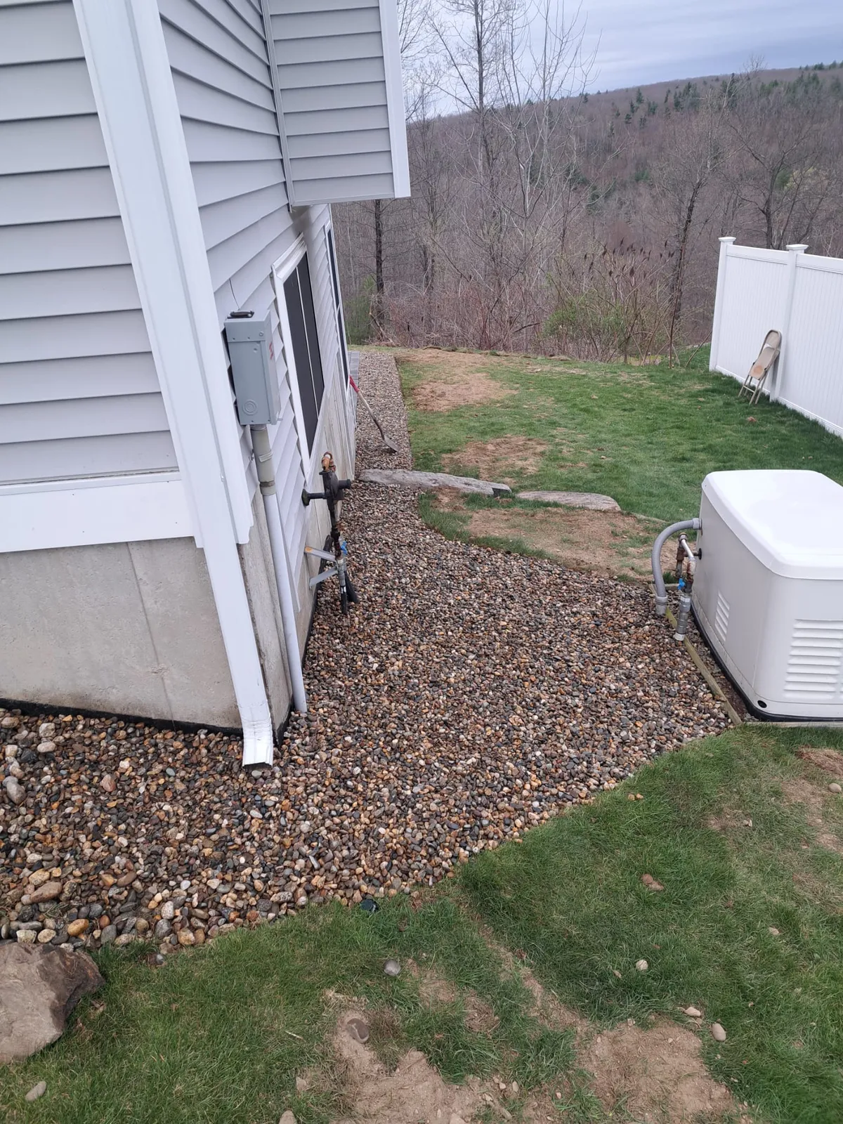 Home siding and foundation along the side yard