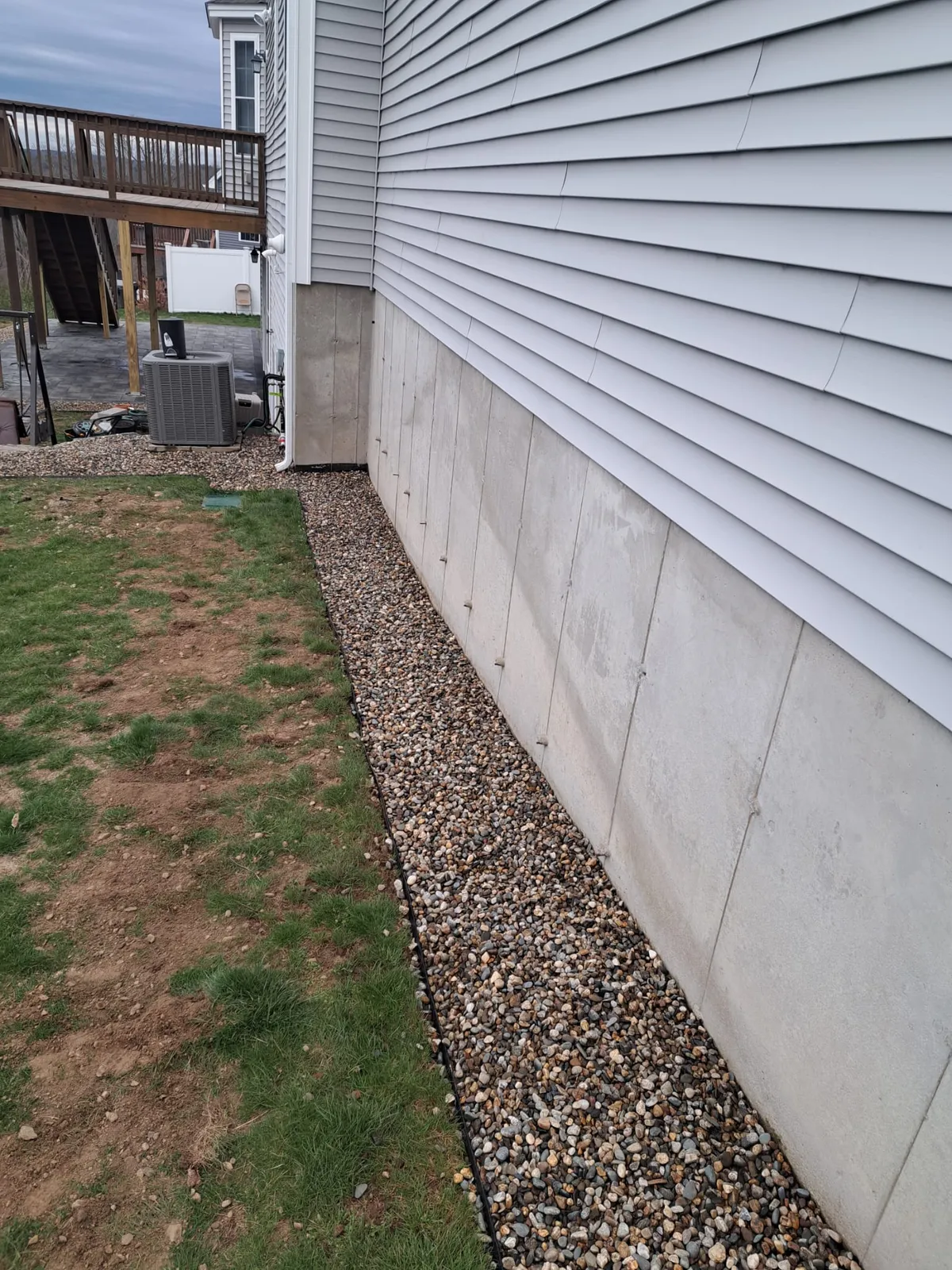 Side of a home beneath an elevated deck