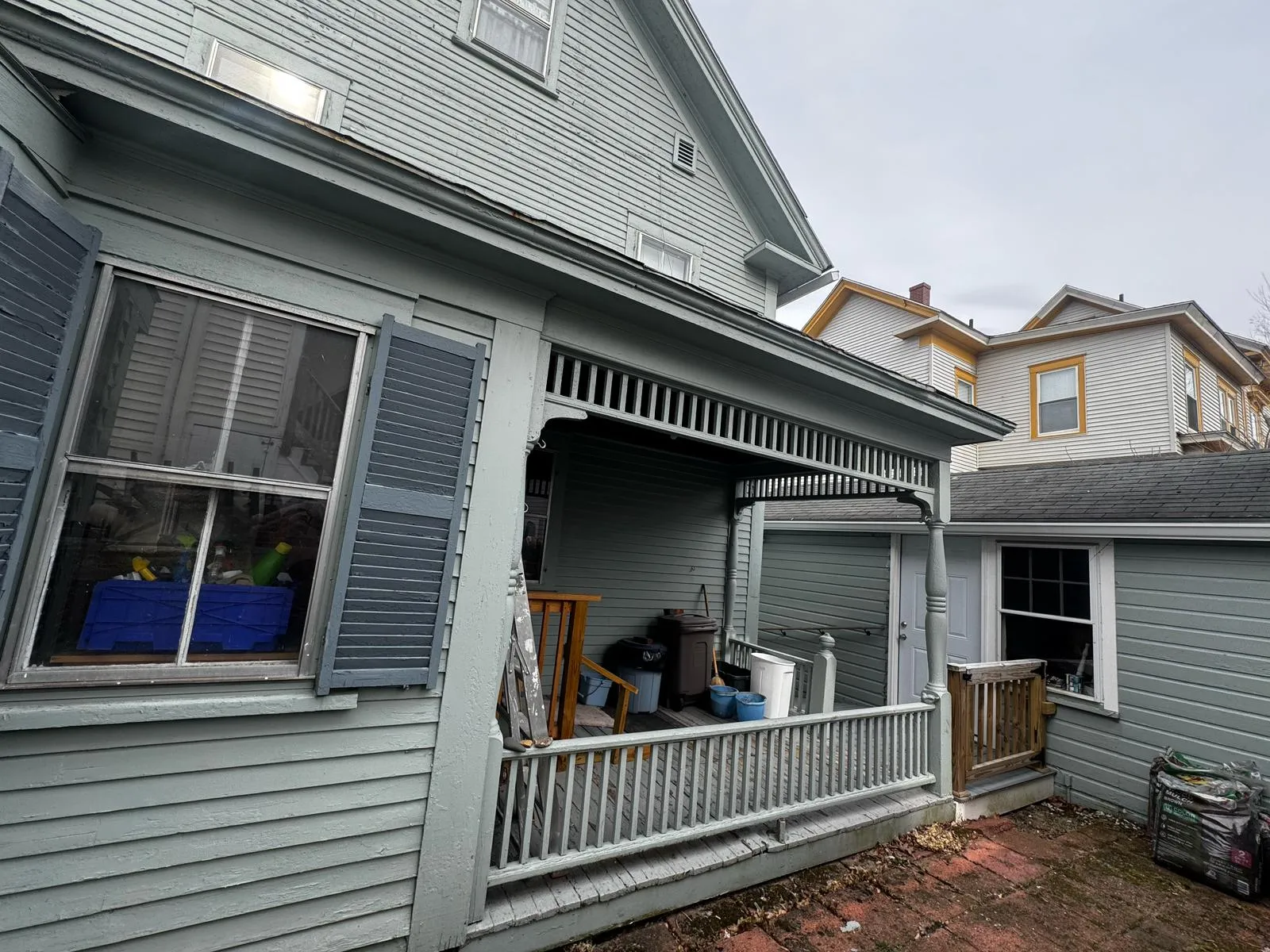 Gray home with a wraparound covered porch