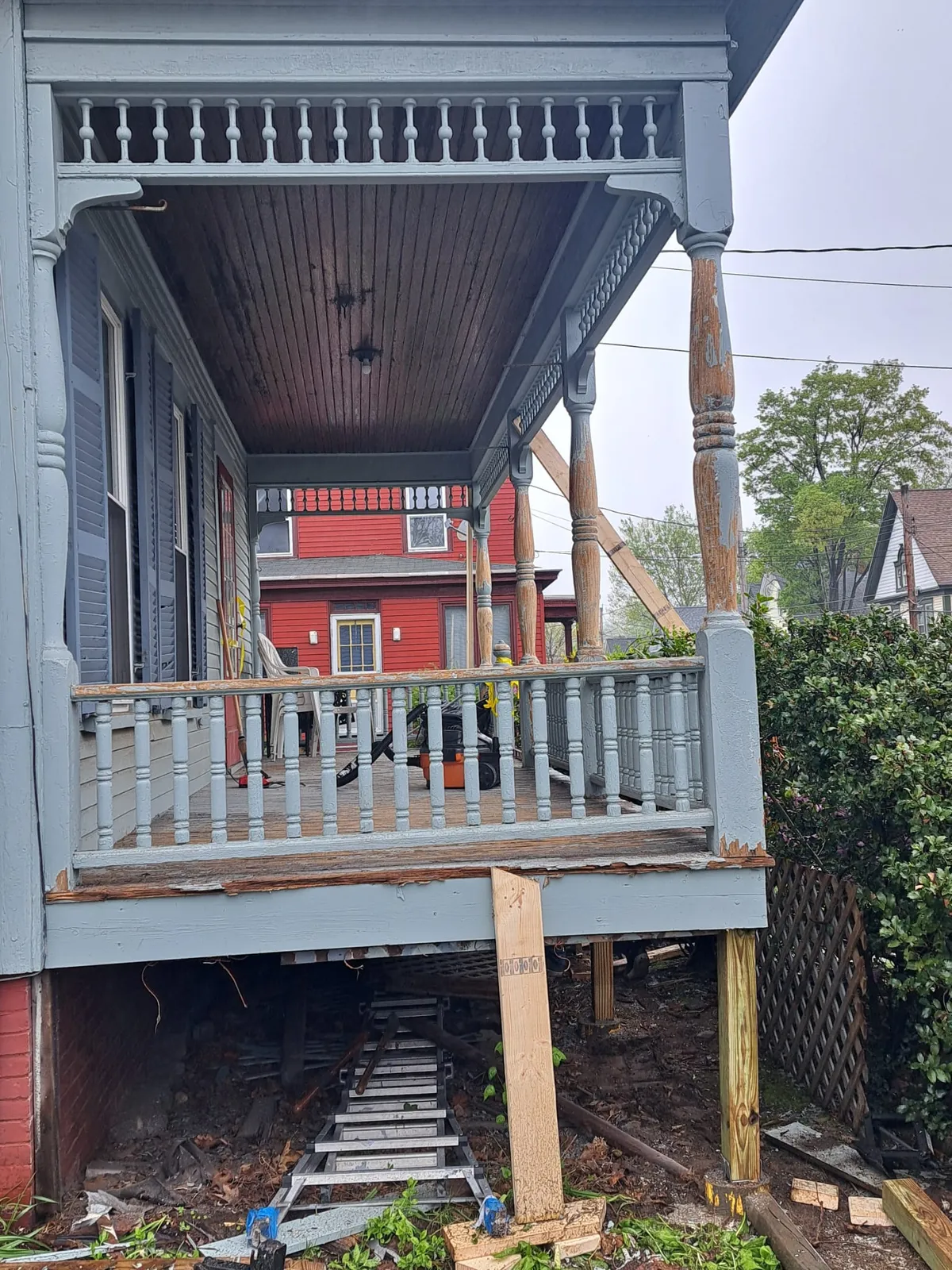 Front porch with gray floor and white posts