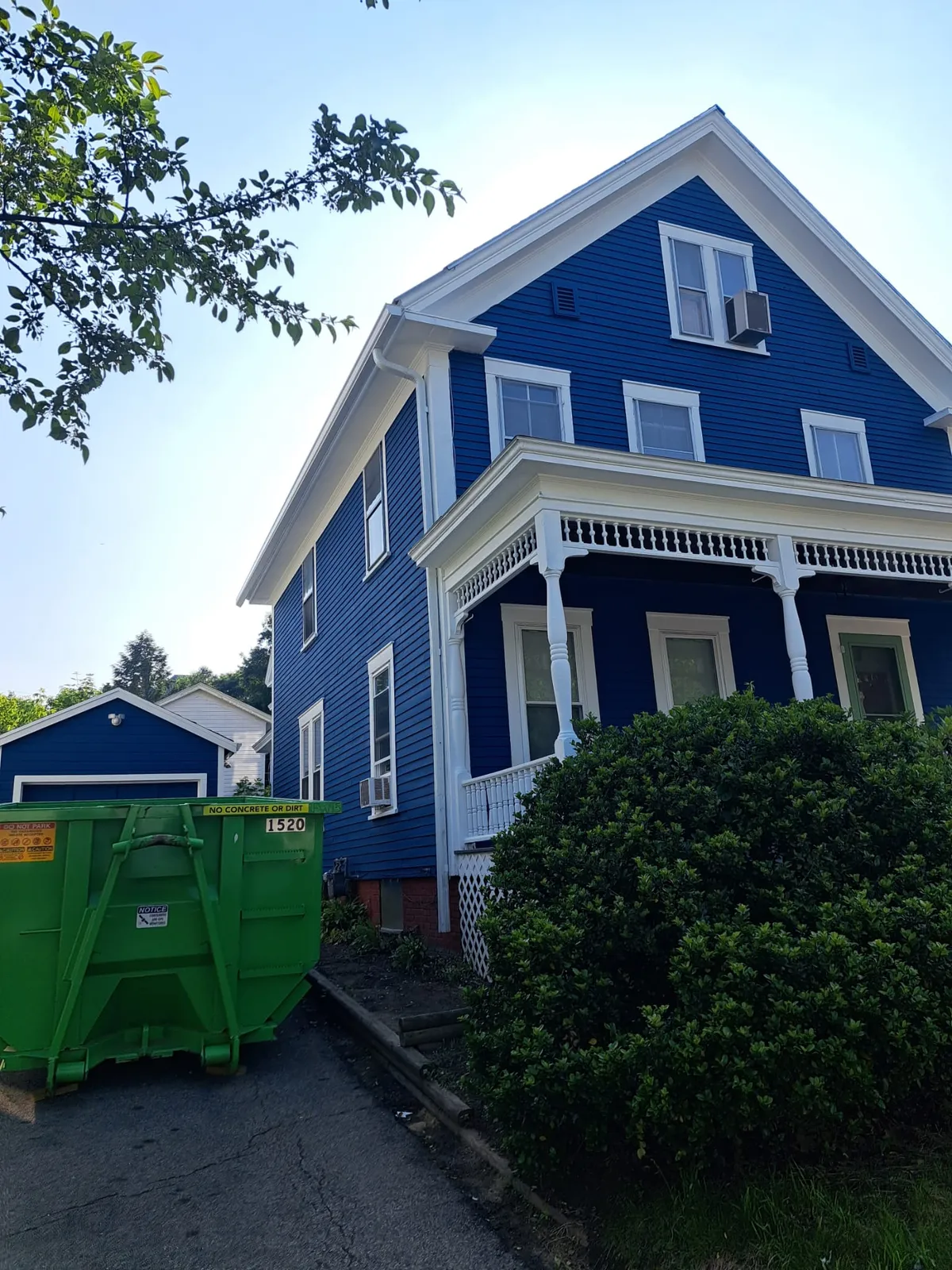 Blue home exterior during a full renovation