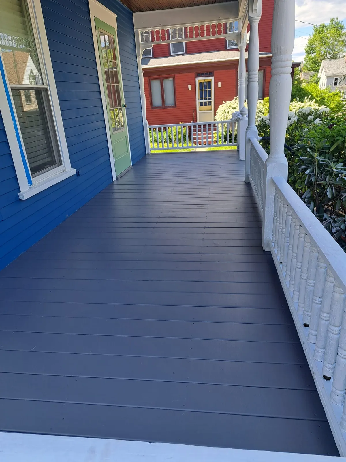 Backyard deck refinished in solid gray stain