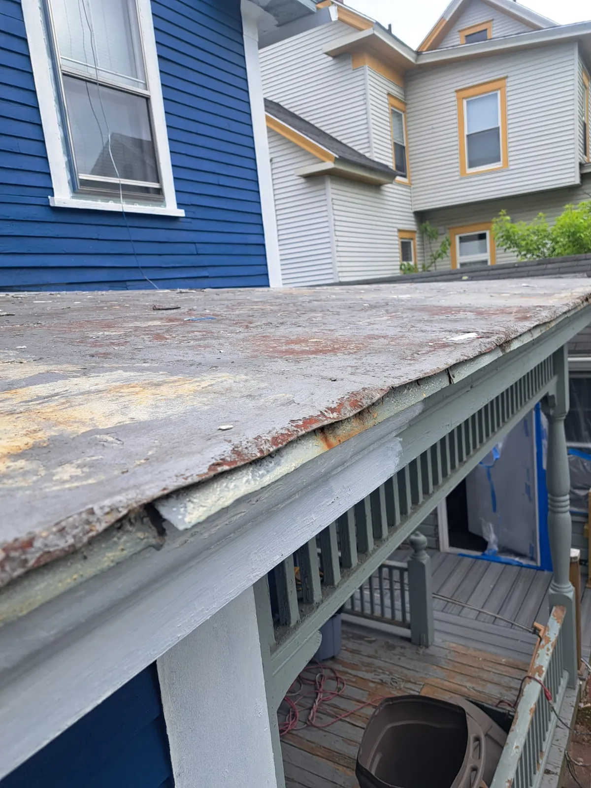 Home exterior and porch during a repaint