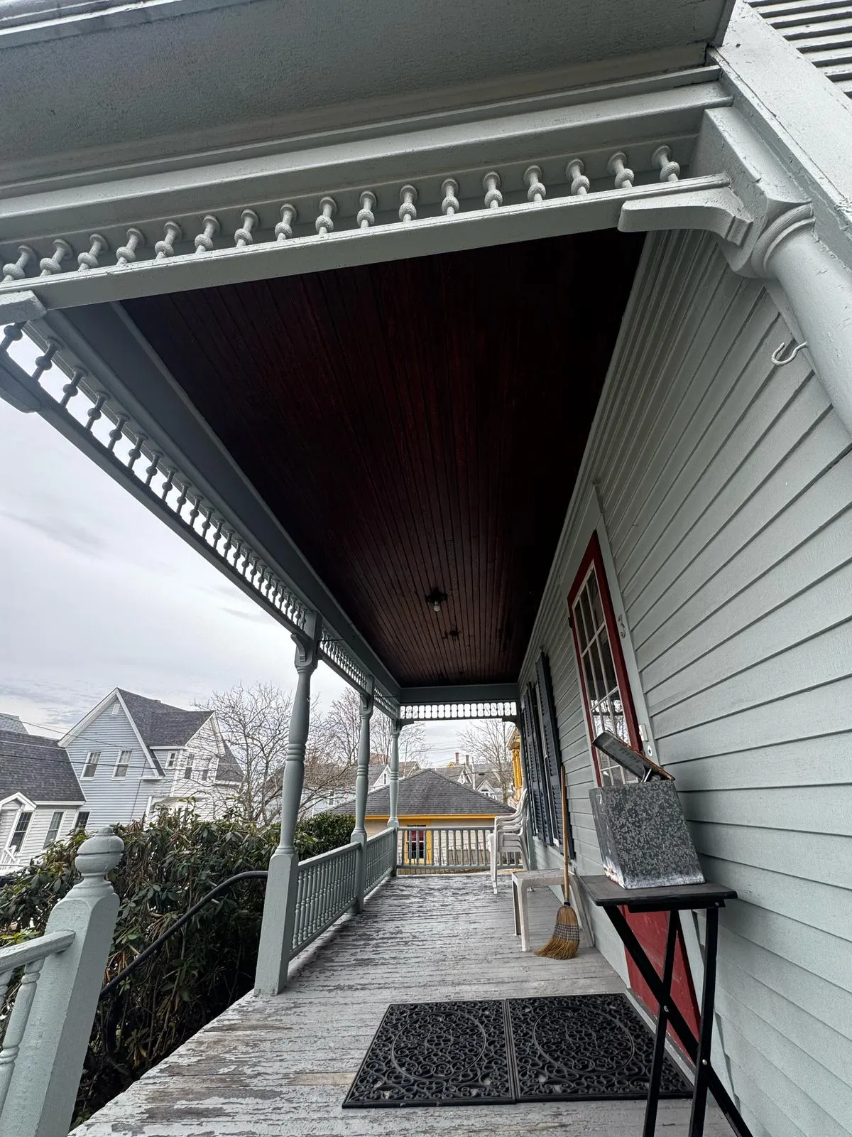 Side entry porch with white columns