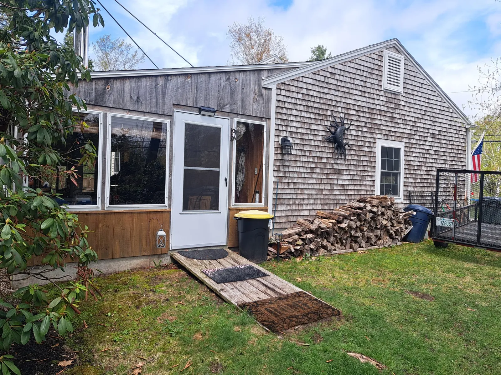 Cedar-shingle home with a rear addition
