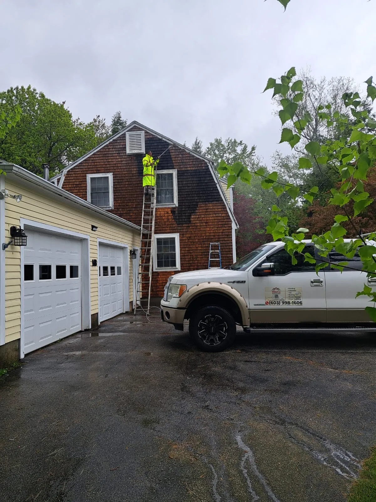 Company truck parked at a completed exterior project