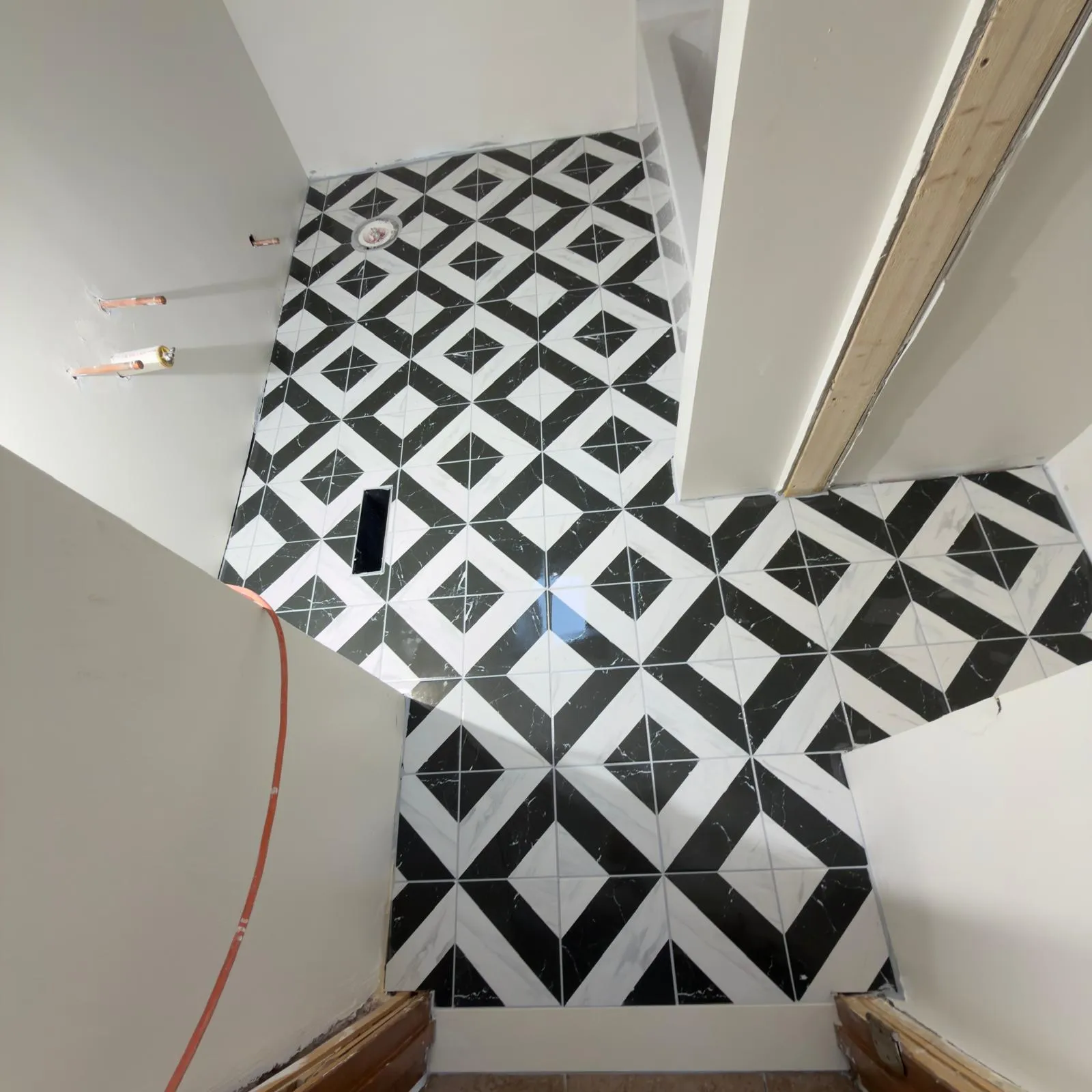 Bold black-and-white geometric tile flooring