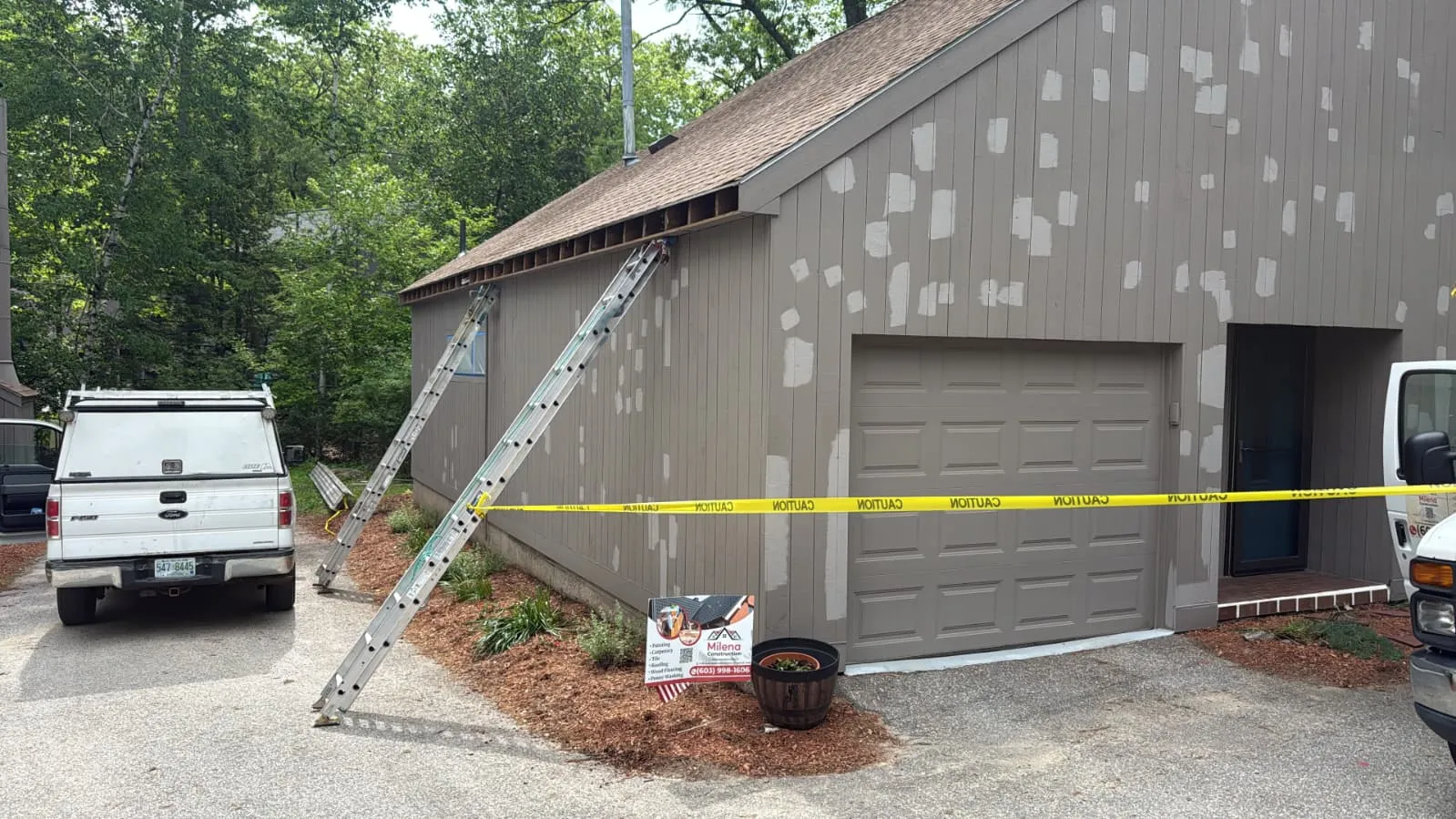 Garage and siding primed before exterior paint