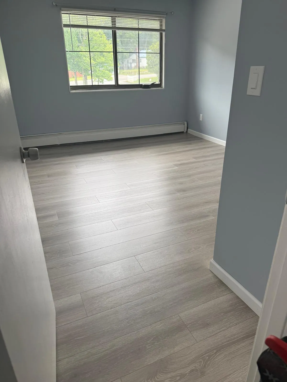 Finished room with new luxury vinyl plank flooring